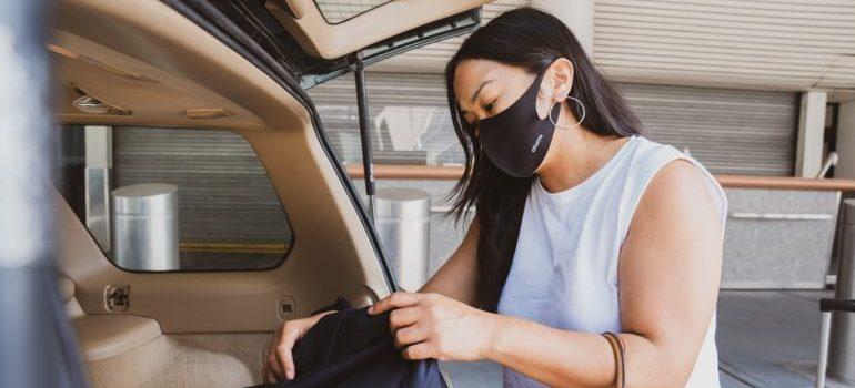 A woman packing for her relocation