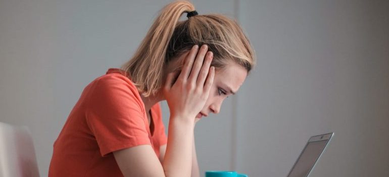 a worried woman sitting at the table