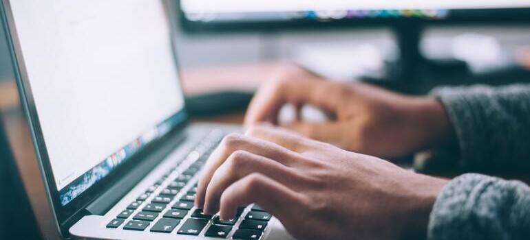 person typing on laptop