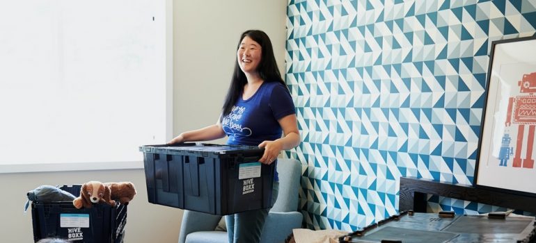 A woman organizing her home before she hire professional packers