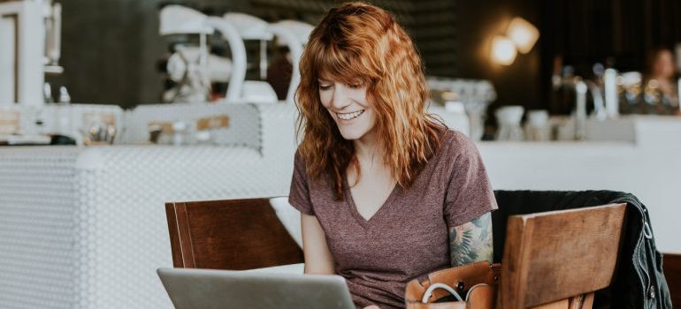 A woman reading moving reviews
