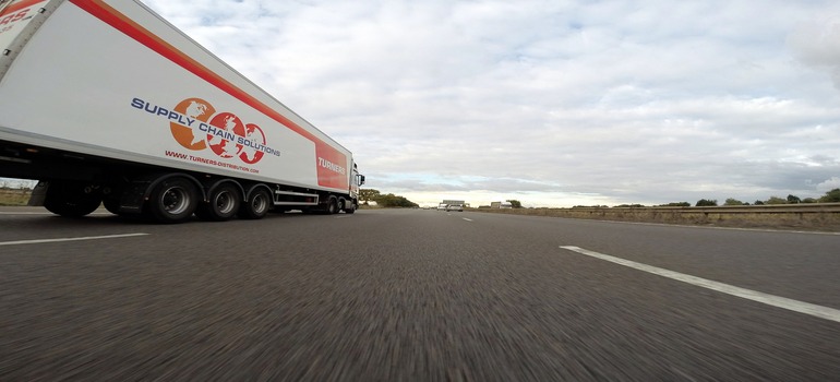highway and a moving truck